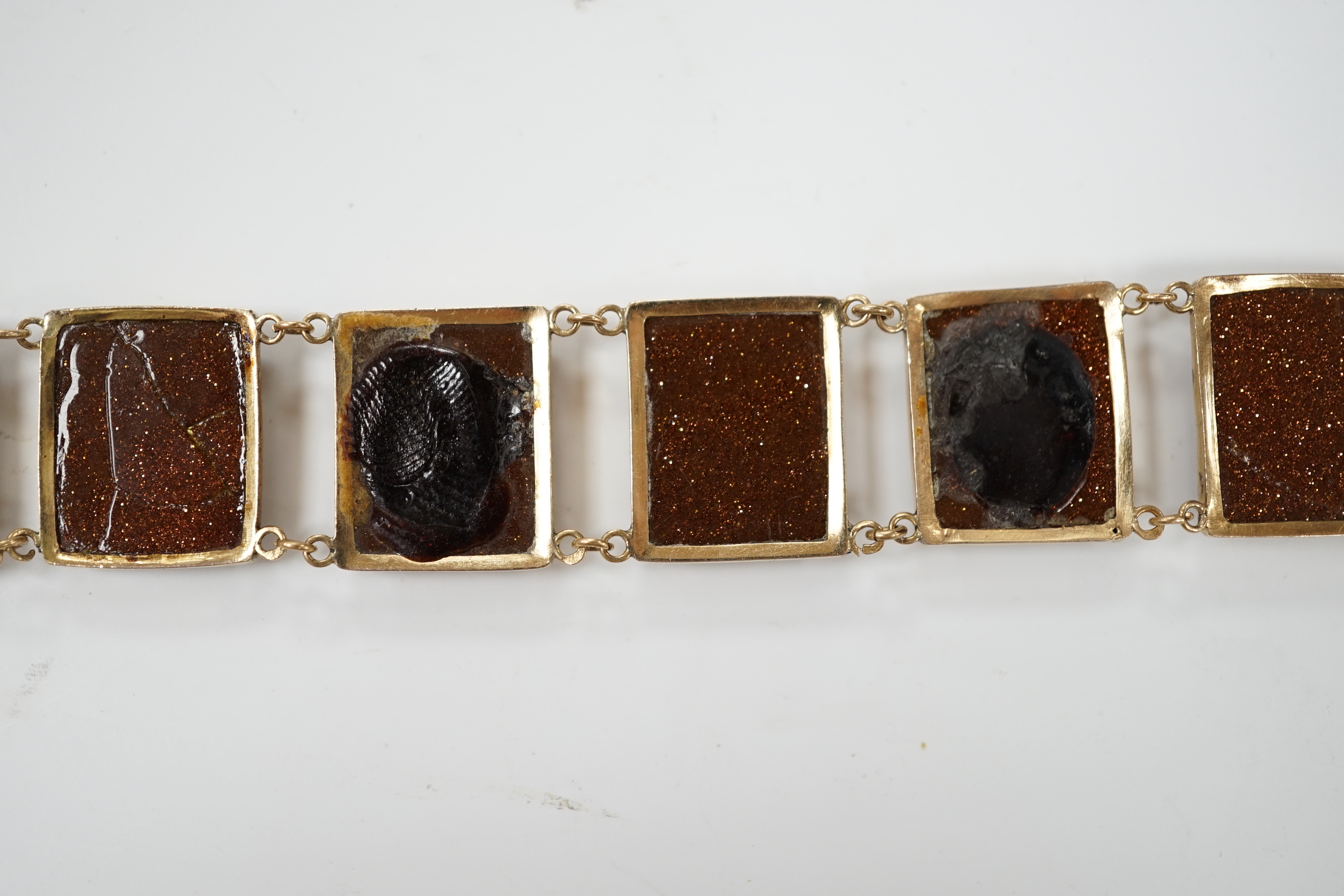 An Italian yellow metal, micro mosaic and goldstone set bracelet, with panels of Italian figures and insects, 17.3cm, gross weight 15.6 grams